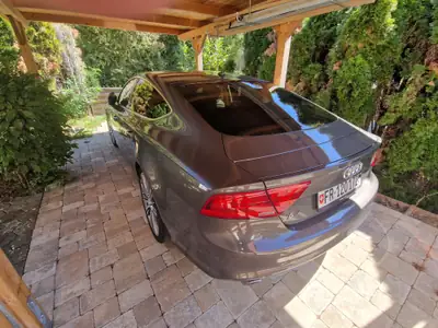 Audi A7 3.0 V6 TDI Quattro — Berline prestige diesel, Head-Up Display — rear view