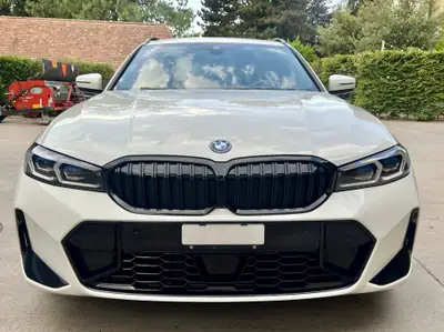 BMW 320e xDrive Touring — Hybride rechargeable M Sport, 60 000 km seulement — côté