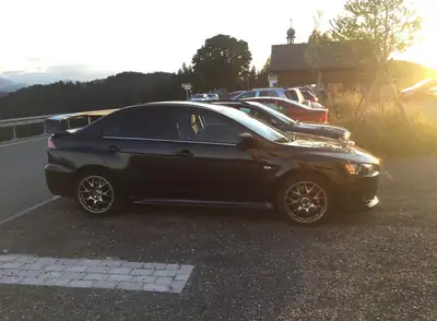 Mitsubishi Lancer Evo 2.0 T MIVEC — Berline sportive 295 ch, transmission intégrale, 64 000 km — Seitenansicht