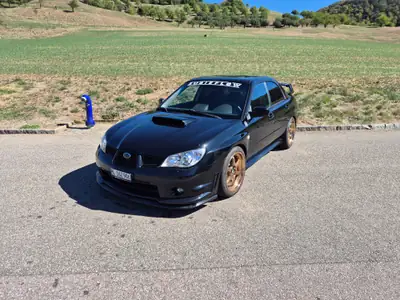 Subaru Impreza 2.5 Turbo WRX — Berline sportive intégrale, 230 ch dynamiques — side view