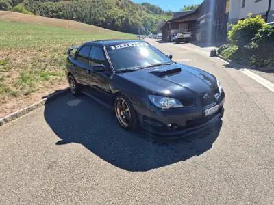 Subaru Impreza 2.5 Turbo WRX — Berline sportive intégrale, 230 ch dynamiques — rear view