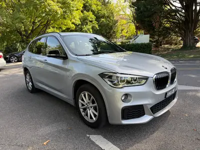 BMW X1 xDrive 20i M Sport — SUV compact dynamique, entretien complet — rear view
