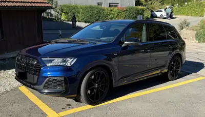 Audi Q7 50 TDI S Line — SUV 7 places premium, entretien AMAG complet — side view