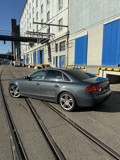 Audi A4 2.0 TFSI 211 ch Quattro — Berline dynamique, historique complet — rear view