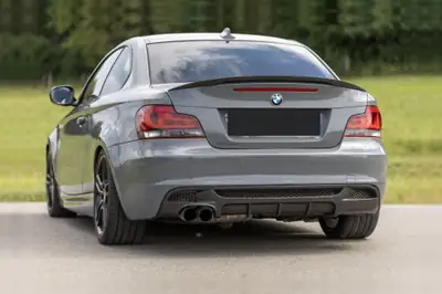 BMW 135i Coupé 2011 — Sportivité pure, 306 ch et transmission manuelle — side view
