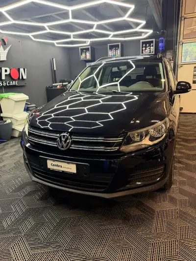 VW Tiguan 1.4 TSI BlueMotion — SUV compact fiable, entretien récent — côté
