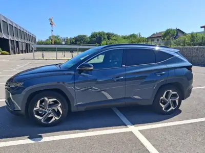 Hyundai Tucson 1.6 T-GDi HEV Vertex 4WD — SUV hybride rechargé, 25'000 km seulement — side view