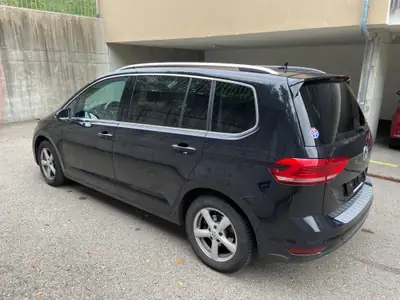 VW Touran 1.5 TSI Highline DSG — Monospace familial spacieux, 7 places modulables — side view