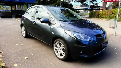 Mazda 2 1.3i 16V Exclusive — Citadine fiable, faible kilométrage, sans accident — Seitenansicht