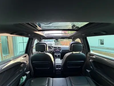 VW Tiguan 2.0 TSI Highline DSG — SUV dynamique 230 PS, 4MOTION, première main — vista posteriore