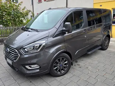 Ford Tourneo Custom 2.0 TDCi 185 Titanium X — Monospace 8 places, équipement complet et entretien récent — côté
