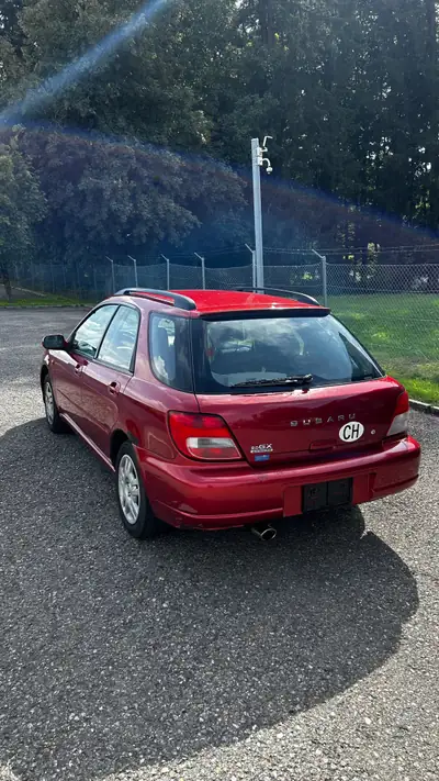 Subaru Impreza 2.0 break — Traction intégrale, fiabilité japonaise éprouvée — rear view