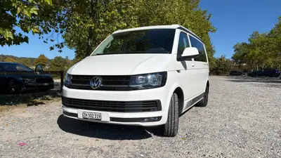VW T6 2.0 TDI 150 Beach Liberty — Camping-car compact, peu kilométré, toiture relevable — exterior view
