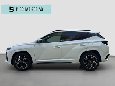 Hyundai Tucson 1.6 TGDI HEV N-Line 4WD — Hybride essence performant, à peine rodé — side view