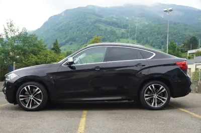BMW X6 M50d Steptronic — SUV coupé diesel premium, 381 ch et transmission intégrale — Heckansicht