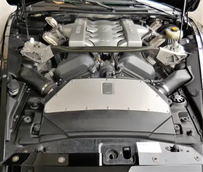 Aston Martin V12 Vanquish S — Coupé sport britannique légendaire, 23'000 km seulement — Miniatur 11