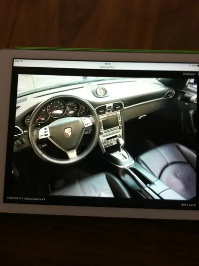 Porsche 911 Cabrio Carrera 4S — Roadster de prestige, 355 ch tous-terrains — côté