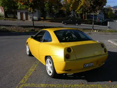 FIAT Coupé 2.0 16V Turbo — Légendaire sportive des années 90, jaune éclatant — Heckansicht