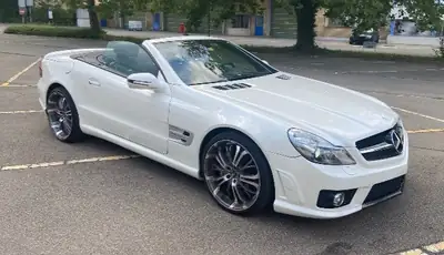 Mercedes-Benz SL 63 AMG — Roadster légendaire, 525 ch de pure performance — fianco