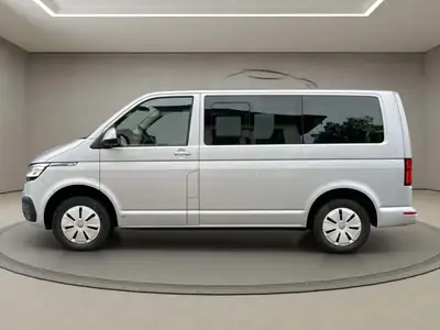 VW T6 Caravelle — Le Van 9 Places Diesel pour Familles et Professionnels — side view