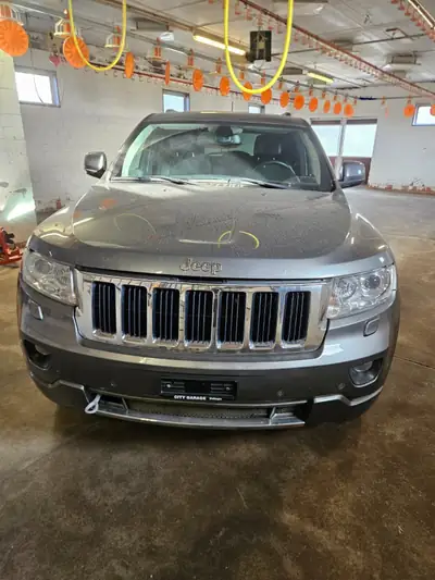 Jeep Grand Cherokee 2013 — SUV robuste 4x4, moteur diesel 241 ch — côté