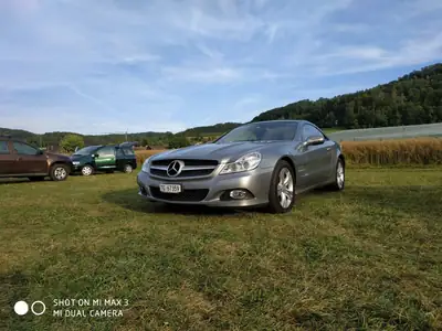 Mercedes-Benz SL 350 — Cabriolet élégant, toit panoramique rare, entretien impeccable — fianco