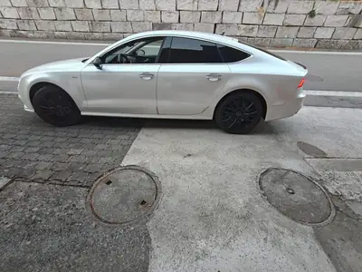 Audi A7 Diesel 218 ch — Berline premium avec suspension pneumatique et équipements avancés — Seitenansicht