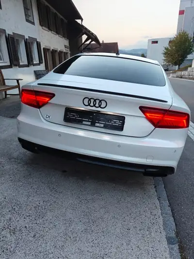 Audi A7 Diesel 218 ch — Berline premium avec suspension pneumatique et équipements avancés — Heckansicht