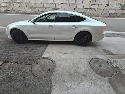 Audi A7 Sportback 3.0 TDI Quattro — Berline prestige diesel, suspension pneumatique — side view