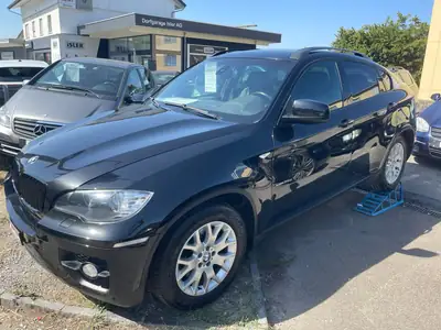 BMW X6 2009 — SUV coupé premium, moteur diesel récent, AWD — side view