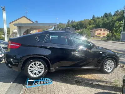BMW X6 2009 — SUV coupé premium, moteur diesel récent, AWD — rear view