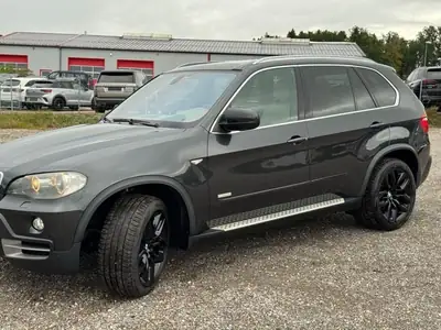 BMW X5 2010 — SUV premium robuste, 272 ch et transmission automatique — fianco